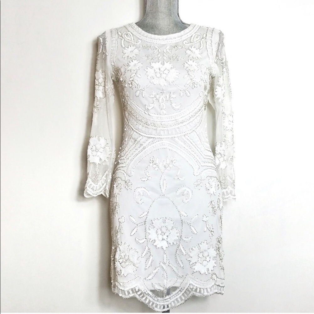 Exotic elegant white dress with embellishment